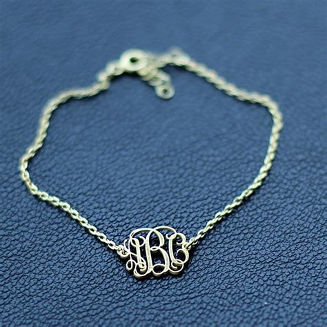 14k gold monogram bracelet.